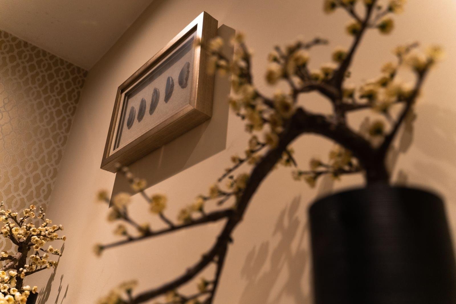 Blossom branches and soft warm light in the spa rooms