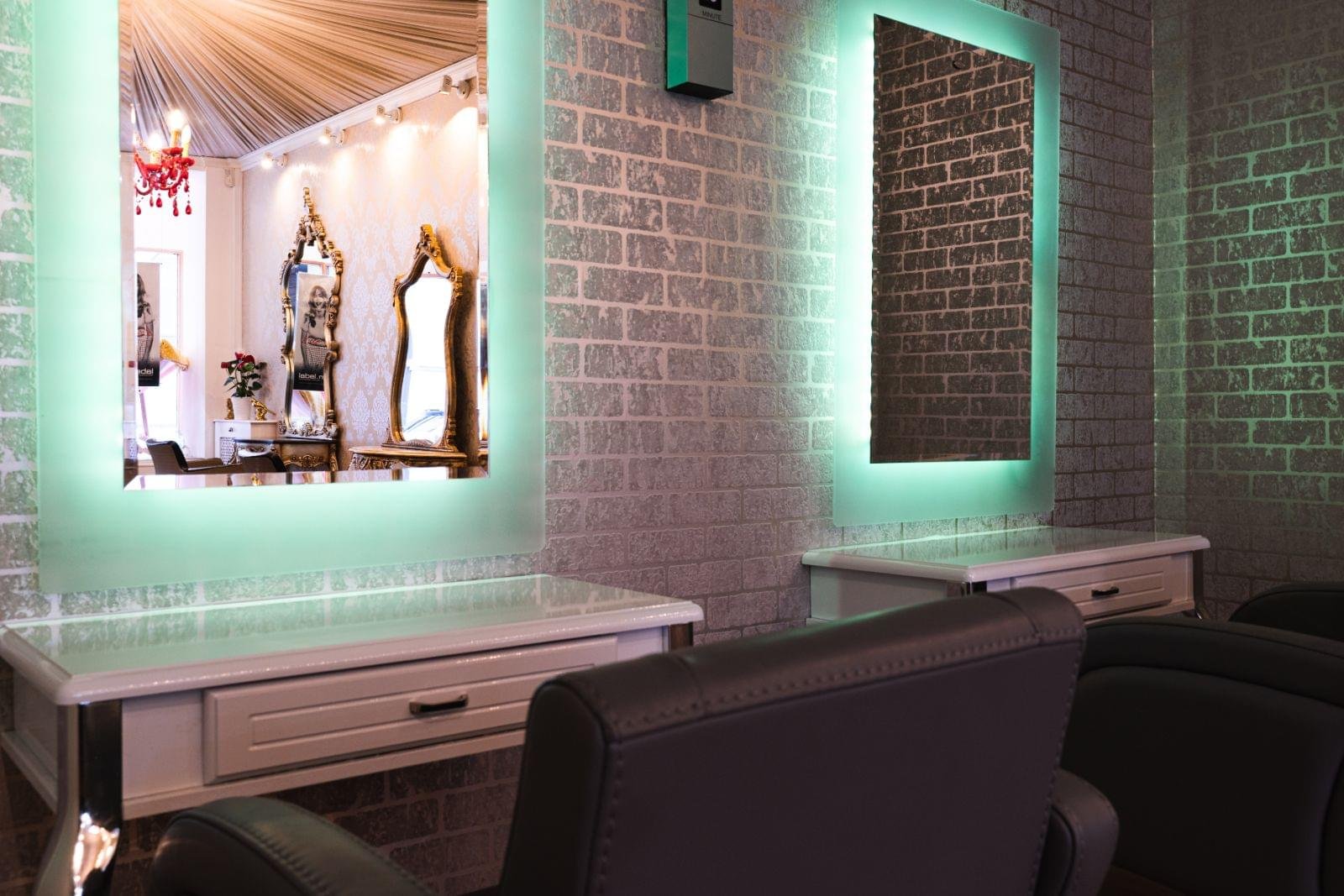 Backlit mirrors and styling stations at Serenity